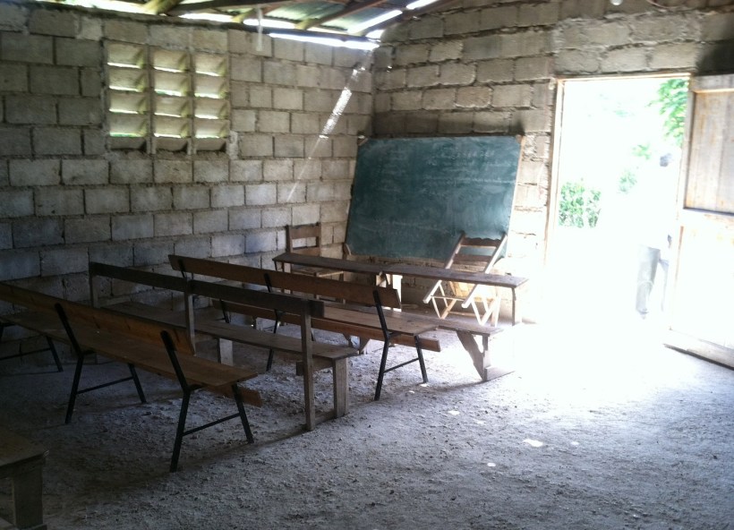 I love how the light bursts through the doorway of this  empty, dimly lit classroom.  It reminds me of Psalm 119:130..."The entrance of Your word gives light." Who can put a price on a Christian education in a third world country?