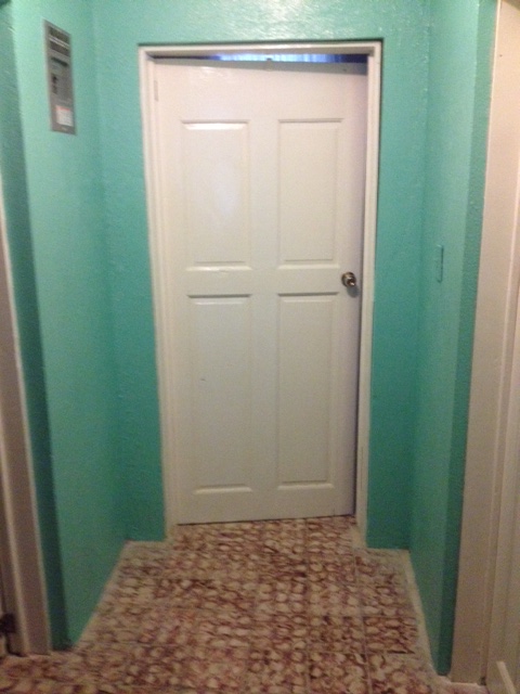 I'm sure there is a perfectly plausible explanation why this door is hanging upside down! I am not used to reaching up to turn the door handle!