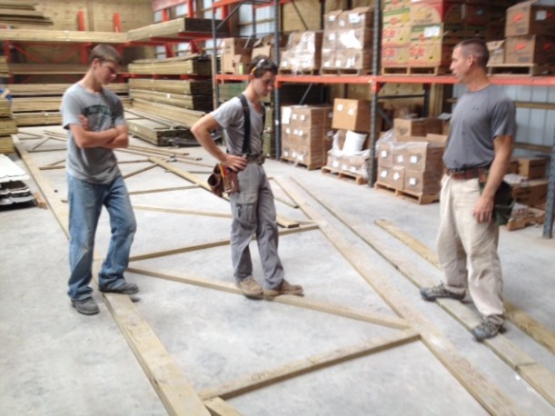 Careful planning for the graduated trusses that would produce the hip roof. 