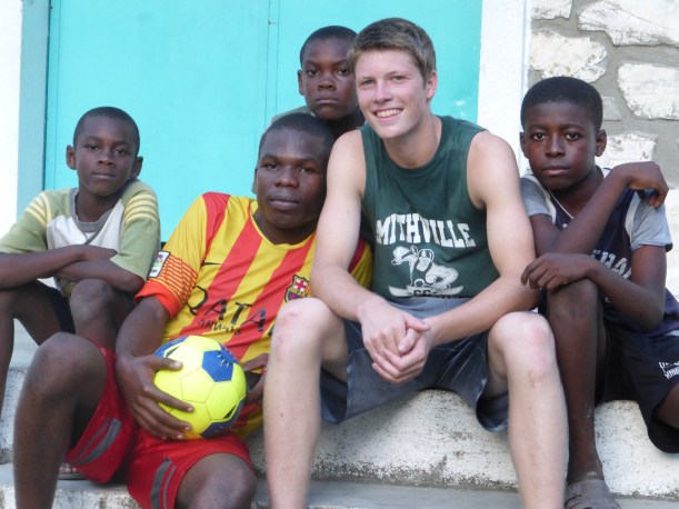 This is our favorite photo! Grant got to teach so many boys a few sports moves.