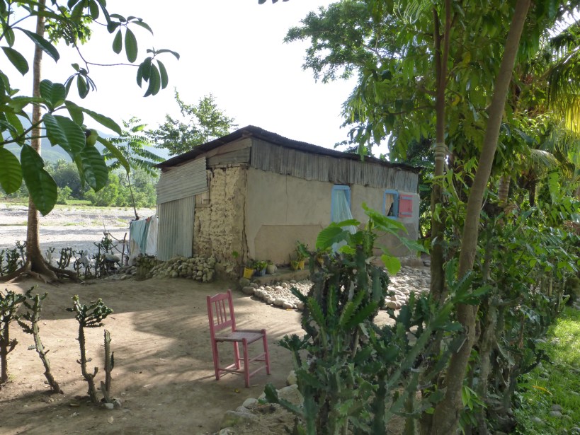 A great shot of how close some people live to the rivers. The river is very low right now. This might be a picture of poverty, but the yard is swept spotless!