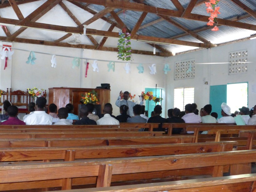 Singing practice after church. Every MEBSH church has the same tin roof and the same benches!