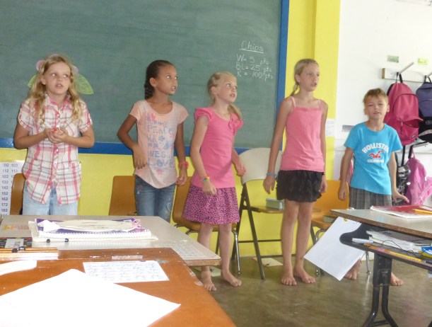 The class held a program for the parents. Where else can you go barefoot to school?
