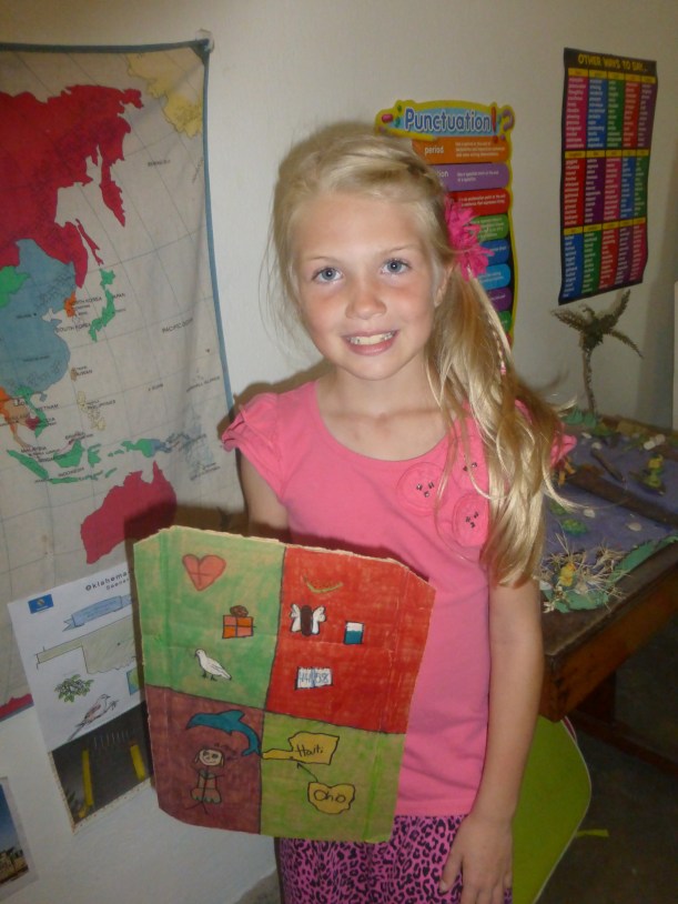 Grace has finished second grade! She is showing us her decorated shield of faith.