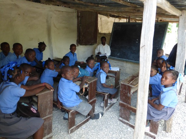 Classrooms in Haiti consist of a blackboard, chalk, a few desks and shelter from the sun. The kids primarily learn and recite from memory.