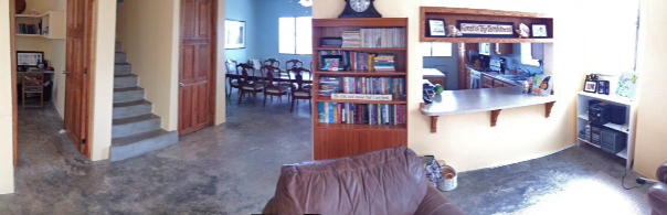 Lots of windows and high ceilings brighten this totally concrete house!