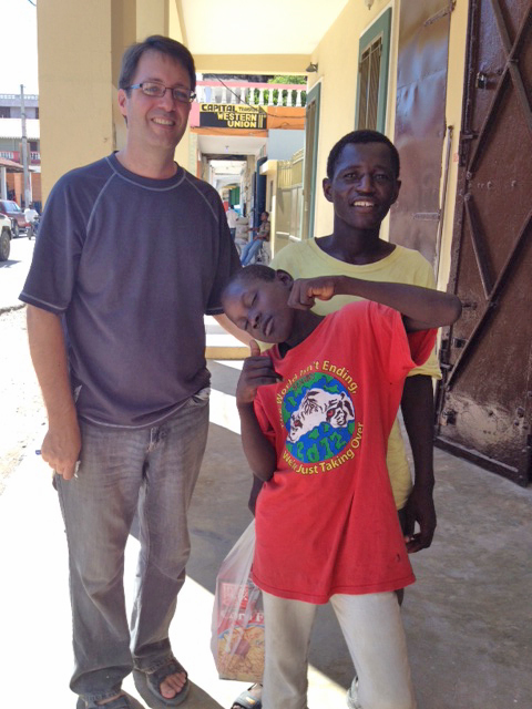 The street boys stand in the doorway and wait wait for their corn flakes!