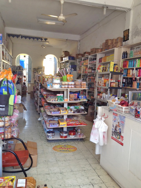 The stores have fairly narrow aisles and items are stocked way up on the walls!