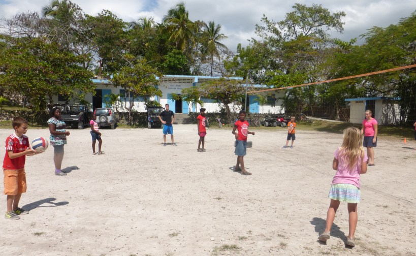 "Mr. Grant" teaching volleyball in front of the Cite Lumiere Christian School!
