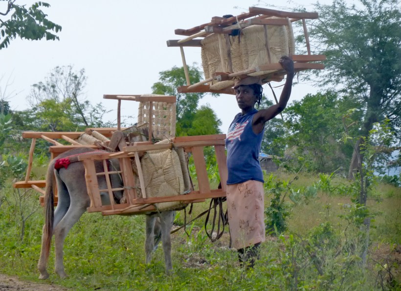 Here is a lady coming down the mountain to sell her chairs. Adline did buy one from her. She was happy!