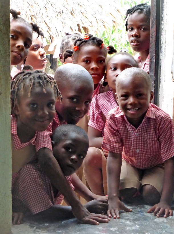 These precious kids were so curious and they looked into the door while the dresses were being passed out.  