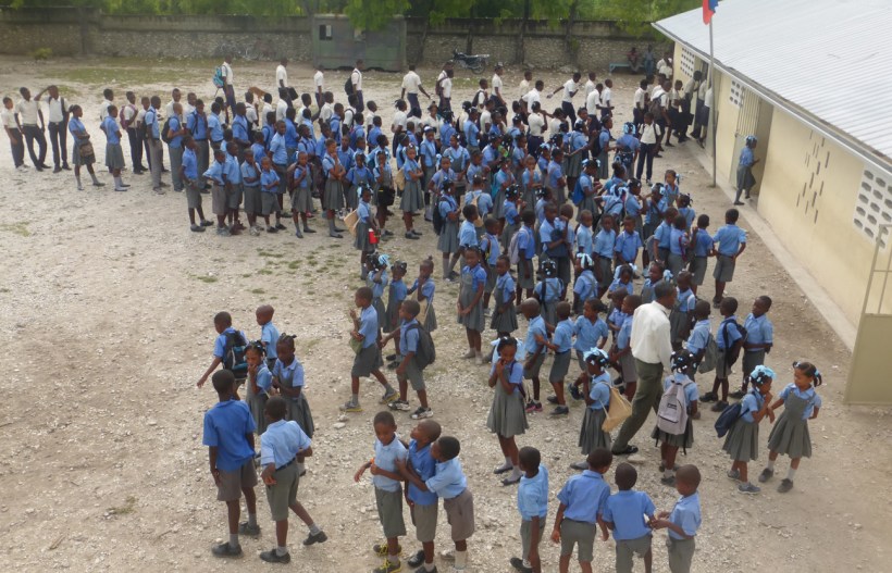 This is the Puit Sales school where the guesthouse is. Every morning the kids line up to salut their flag and have a prayer before school begins. 