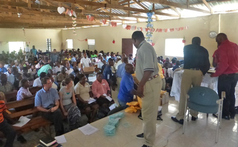 Handing out Bibles and tracts at the end of our evangelism presentation.