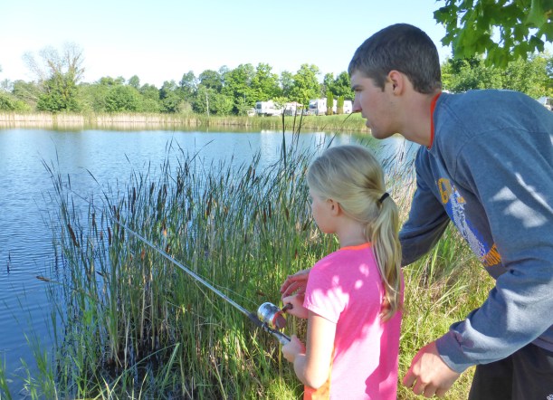 Here is Evan showing Grace how to fish! And she caught some fish herself! 