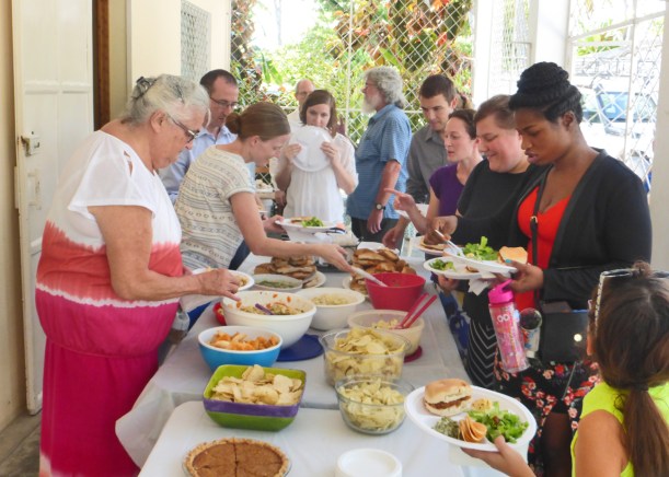 Sharing a meal with locals and visitors after an English service at our home!