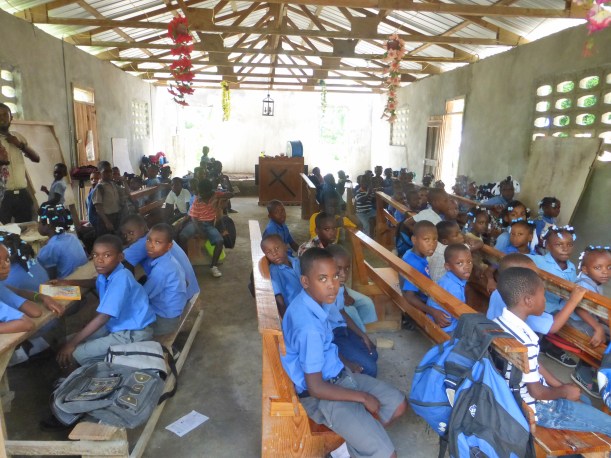 This is a typical school scene. All the classes are in the church in one room!