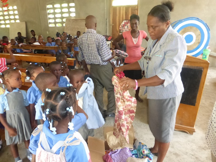 The pastors wife passed out clothes to each child!