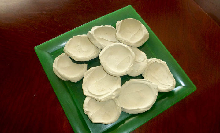 Mud cookies, 1/2¢ each, are a mixture of mud, cornmeal and salt. The sad reality is this is the only affordable food for some families. It's sort of like eating a piece of pottery.