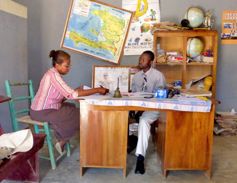 The globes, the map of Haiti, the hand bell, the gray walls...is this set up for a school play or is this the real thing? Take the picture!!