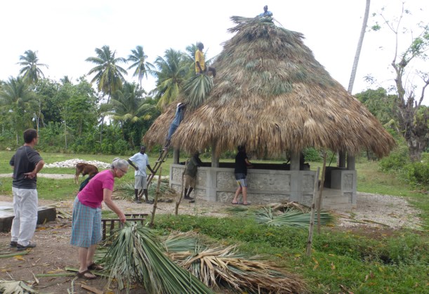 While visiting the dairy project, we got to see the top of the gazebo being finished!