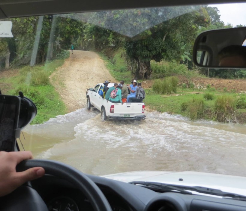 Grant and some friends are in the back of the truck ahead as we cross a river.