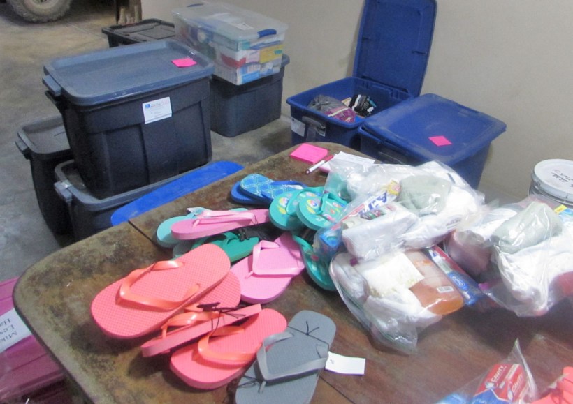 Many, many totes full of clothing, flip flops, and personal care items!